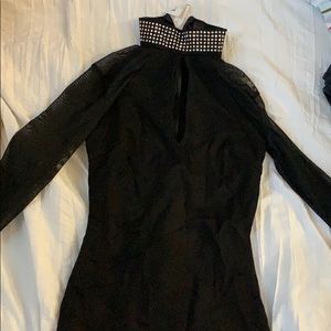 Tight dress with mesh sleeves and studded neck